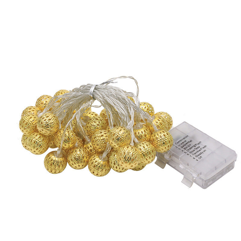 Moroccan metal globe string light coiled bundle and battery pack