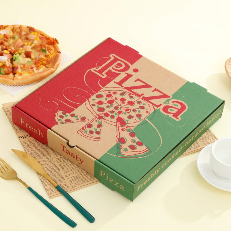 Printed pizza box shown closed beside a pizza