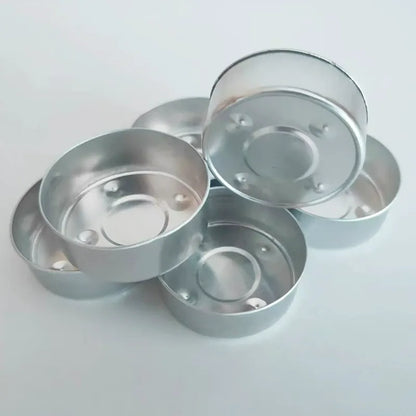 Aluminum tealight cups empty containers showing rolled rims and base