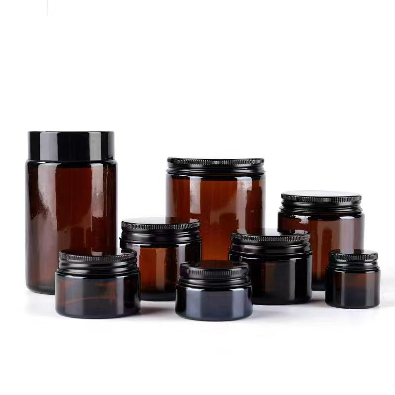 Amber glass jar frosted translucent finish black screw lid