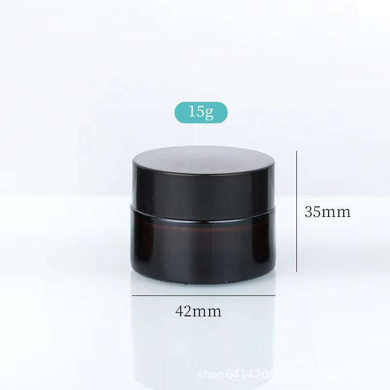 Amber glass jar 15g cosmetic size black screw lid