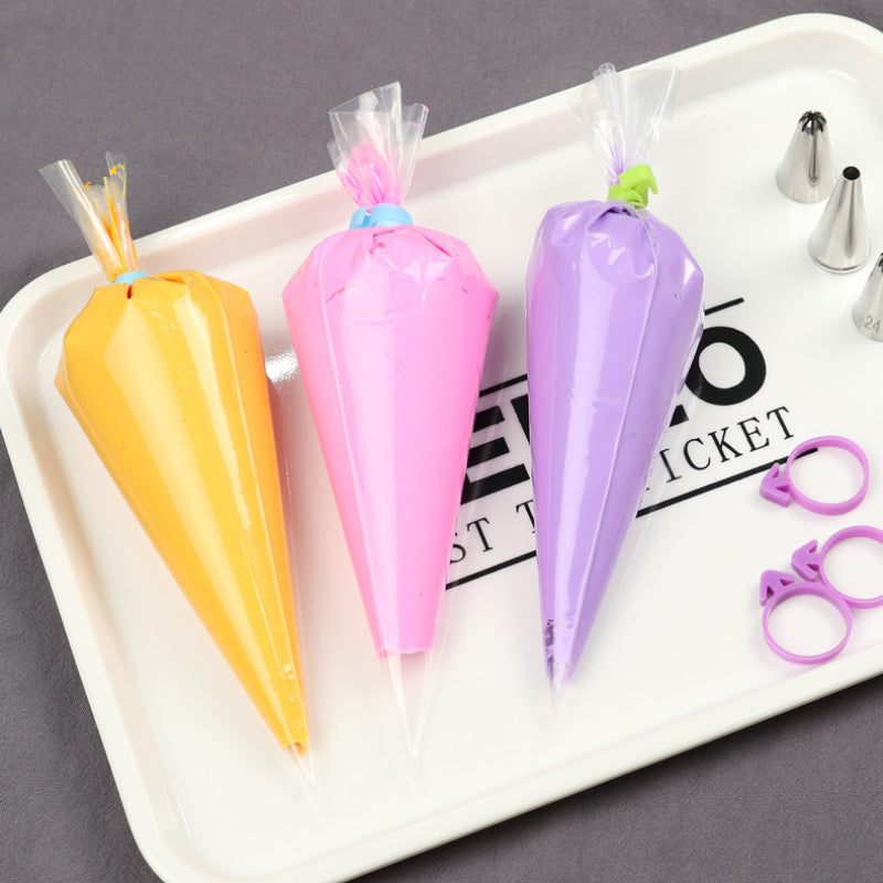 Disposable pastry piping bag - Assorted colored frosting bags on prep tray