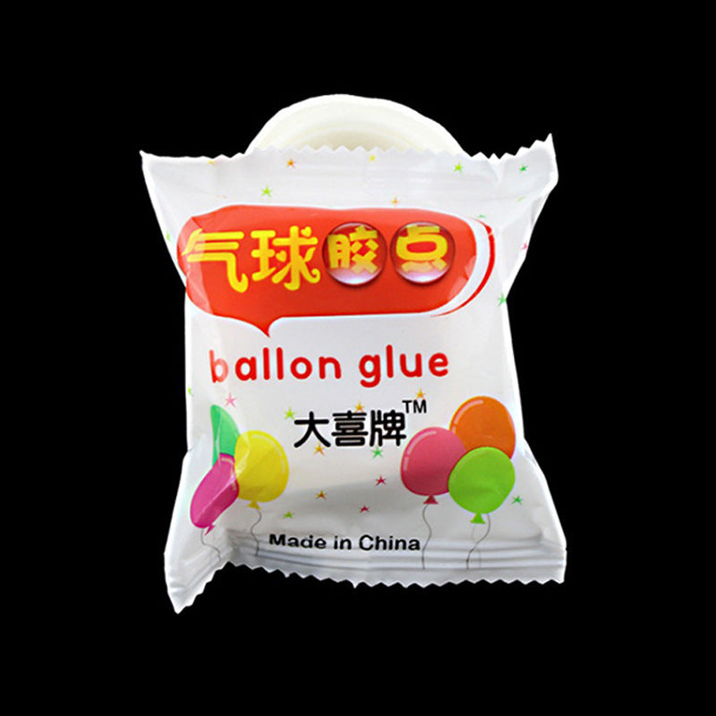 Balloon glue dots 100-count roll in Daxi branded polybag packaging