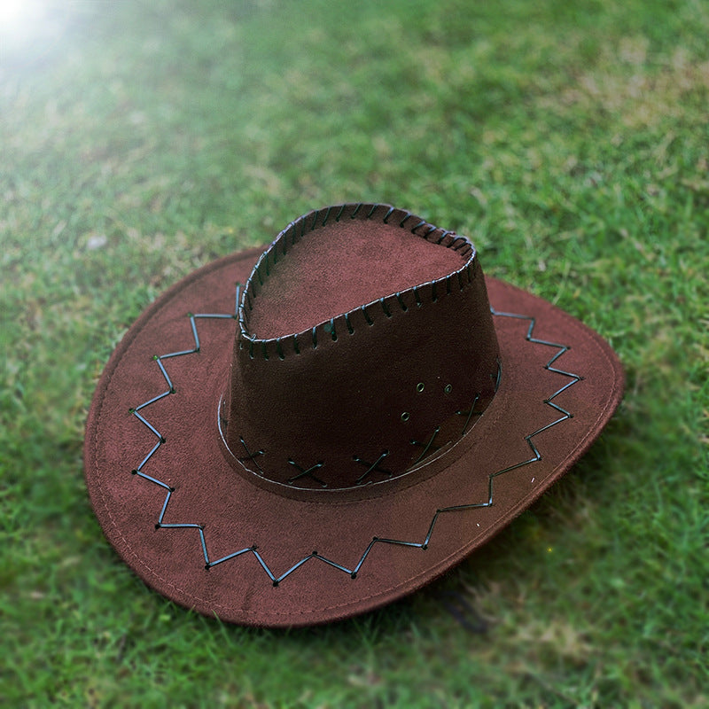Classic felt cowboy hat in dark red brown on grass