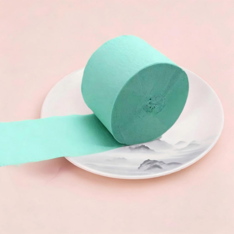 Crepe paper streamer mint green compact roll extending ribbon
