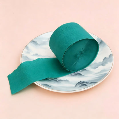 Crepe paper streamer dark Christmas green roll extending strip