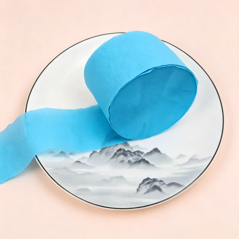 Crepe paper streamer sky blue compact roll unrolled ribbon
