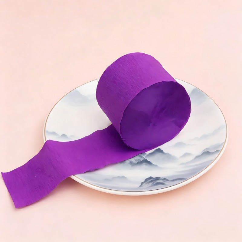 Crepe paper streamer deep purple wound roll unrolled ribbon