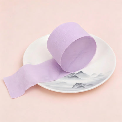 Crepe paper streamer light purple coiled roll extending strip