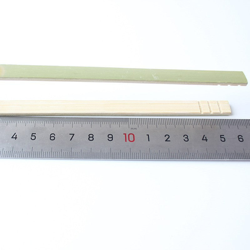 Bamboo food tong sixteen centimeter model beside steel ruler
