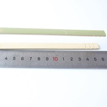 Bamboo food tong sixteen centimeter model beside steel ruler