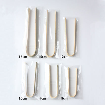 Bamboo food tong eight centimeter length beside steel ruler