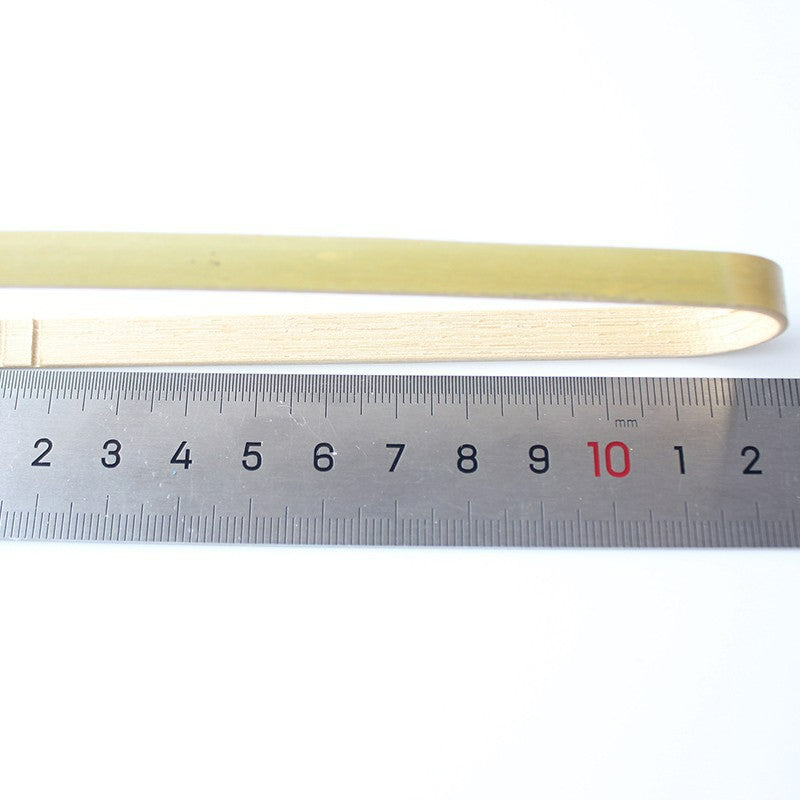 Bamboo food tong twelve centimeter size beside steel ruler