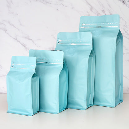 Coffee valve bag pastel blue four capacity graduating lineup showing side gussets and flat base