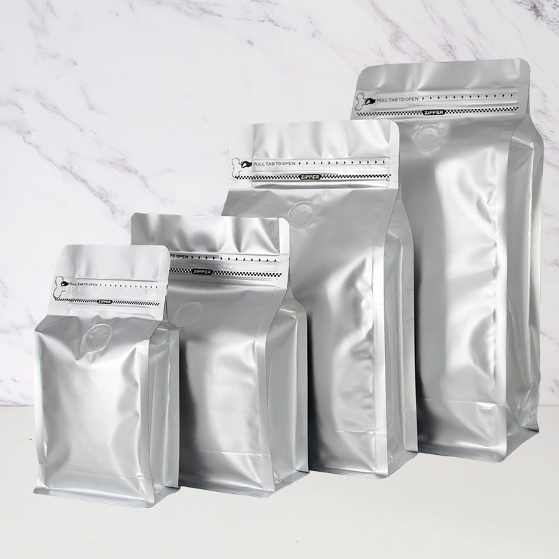 Coffee valve bag matte silver four capacity graduating lineup with degassing valve and pull tab zipper