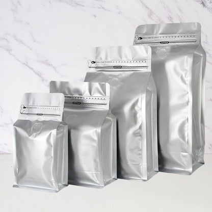 Coffee valve bag matte silver four capacity graduating lineup with degassing valve and pull tab zipper