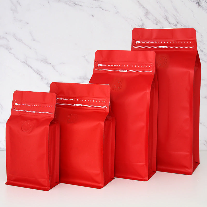 Coffee valve bag vibrant red four capacity graduating lineup with top pull tab zipper and valve