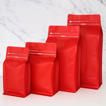 Coffee valve bag vibrant red four capacity graduating lineup with top pull tab zipper and valve