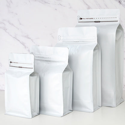 Coffee valve bag matte white four capacity graduating lineup with pull tab zipper and flat base