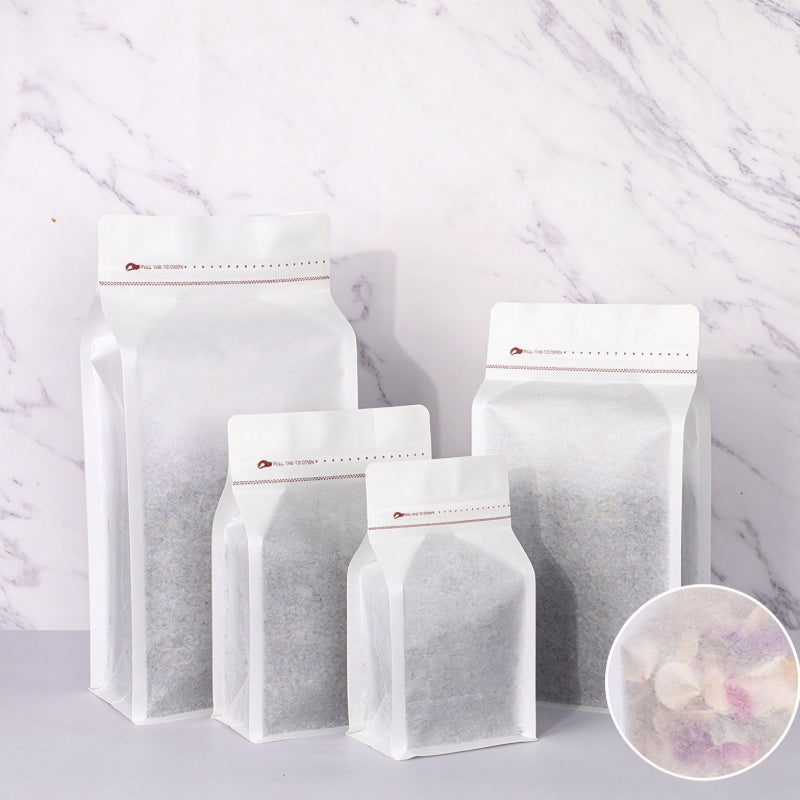 Coffee valve bag frosted cotton paper four capacity graduating lineup showing semi-translucent texture