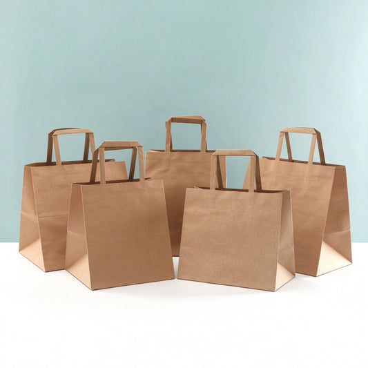 Flat handle kraft bag tiered group arrangement showing multiple commercial takeout sizes
