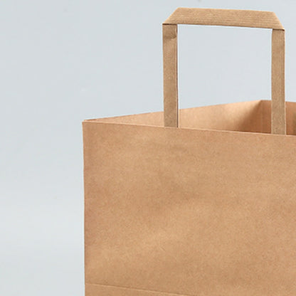 Flat handle kraft bag close-up detail showing reinforced inner flat paper handle attachment