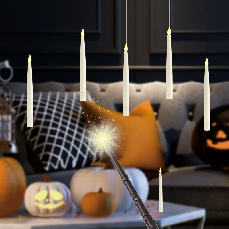 Floating LED taper candle Halloween themed ceiling display with wand remote