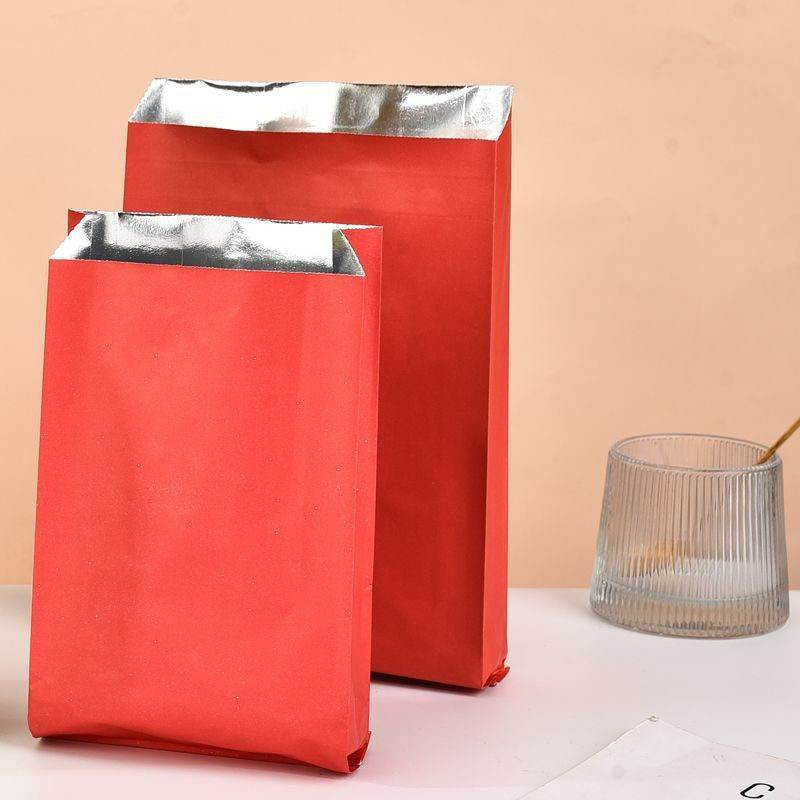 Foil-lined takeout bag vibrant red exterior with two upright sizes showing open top and silver foil lining