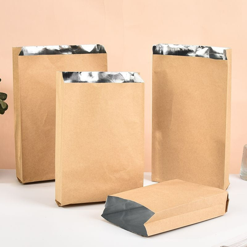 Foil-lined takeout bag natural brown kraft option with upright sizes and folded base showing silver foil interior