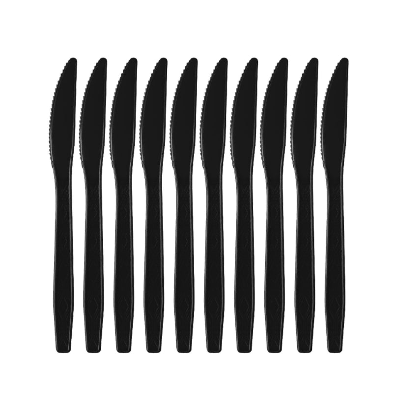 Graduation party tableware black plastic dinner knives aligned in row
