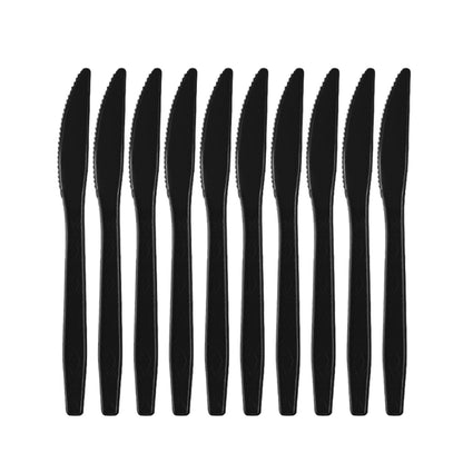 Graduation party tableware black plastic dinner knives aligned in row
