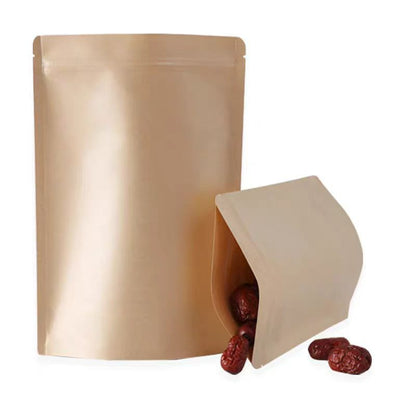 Foil-lined flat pouch upright beside tilted open pouch