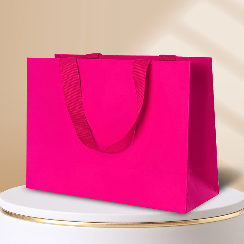 Kraft gift bag rose magenta horizontal landscape finish with matching wide embedded ribbon handles