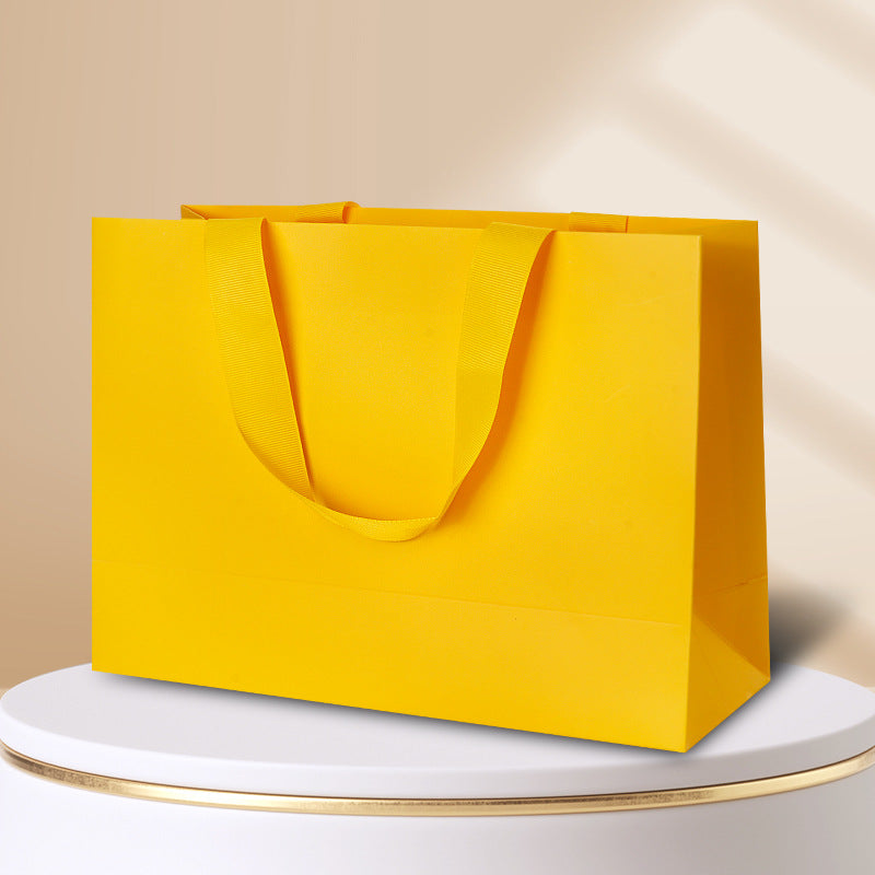 Kraft gift bag lemon yellow horizontal landscape finish with matching wide embedded ribbon handles