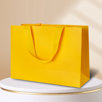 Kraft gift bag lemon yellow horizontal landscape finish with matching wide embedded ribbon handles