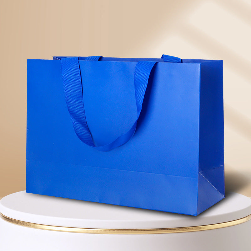 Kraft gift bag klein blue horizontal landscape finish with matching wide embedded ribbon handles