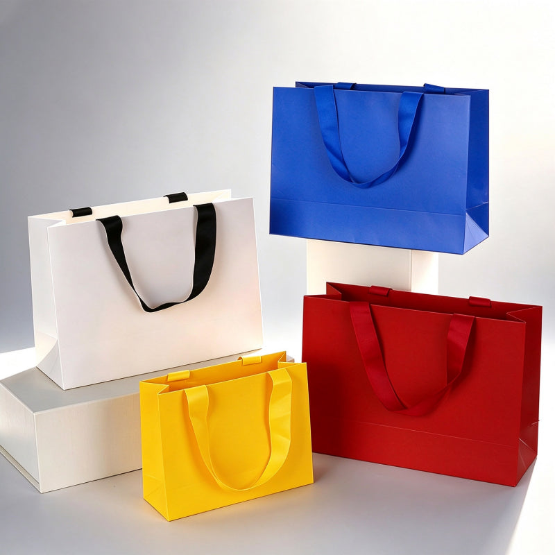 Kraft gift bag multi-color tiered arrangement showing white yellow red and blue horizontal bags