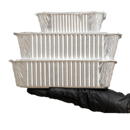 Aluminum foil container vertical tiered stack showing ribbed sidewalls and curled rims
