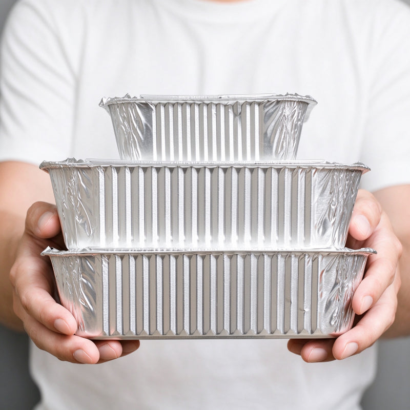 Aluminum foil container nested set of three sizes showing graduated depth profile