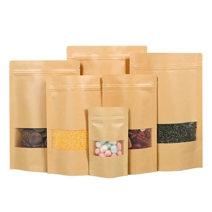 Kraft stand-up pouch tiered group of six brown pouches showing top tear notches and heat-sealable zip headers