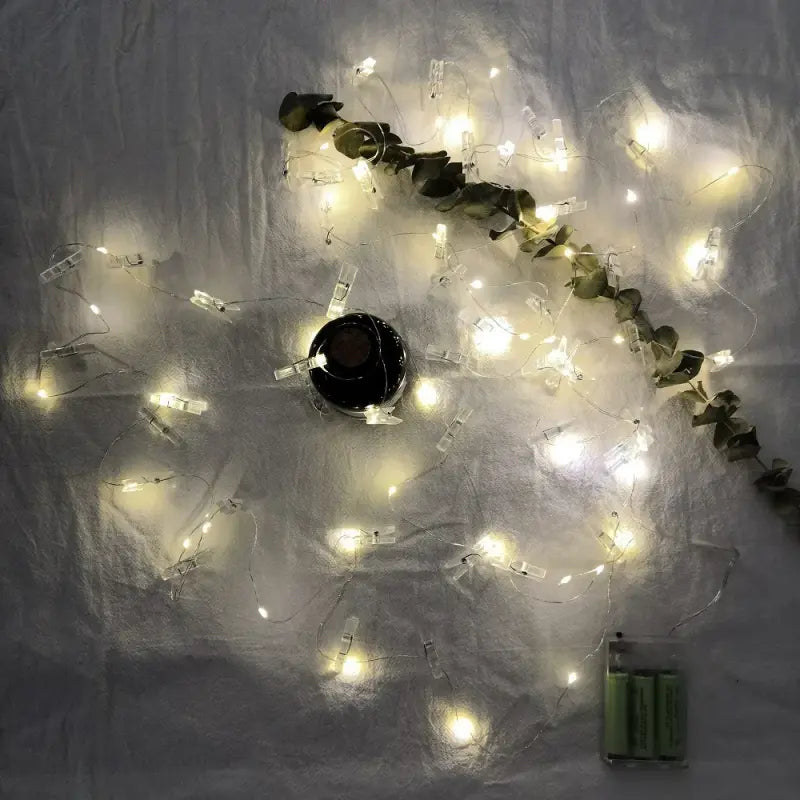 LED photo clip string light coiled bundle illuminated overhead view