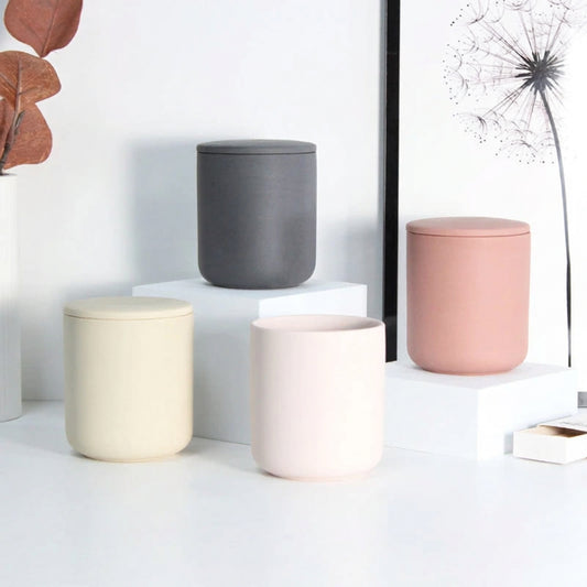 Ceramic candle vessel four assorted matte colors tiered group display