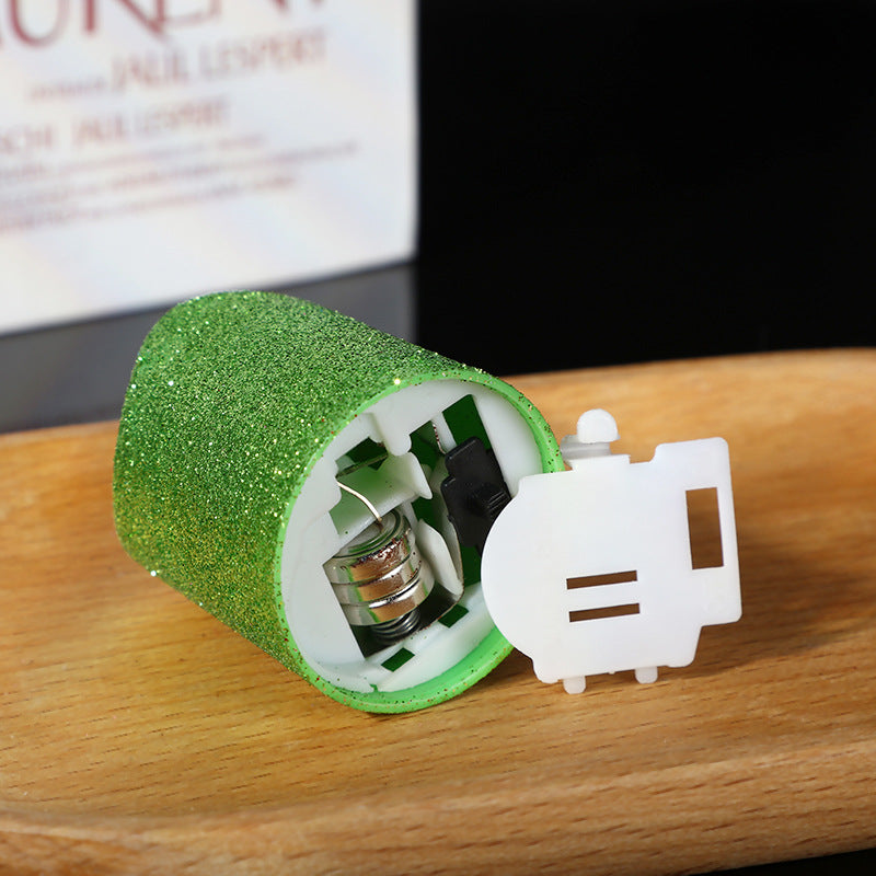 Glitter flameless LED candle inverted base battery compartment detail