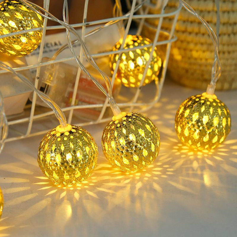 Moroccan metal globe string light geometric shadow pattern projection