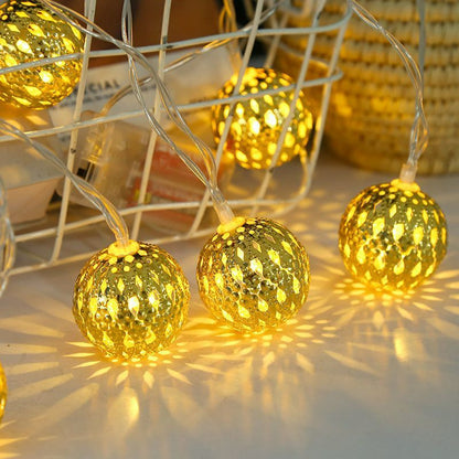 Moroccan metal globe string light geometric shadow pattern projection