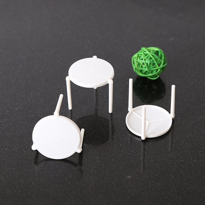 Pizza saver stand three white units top disc and three legged base view