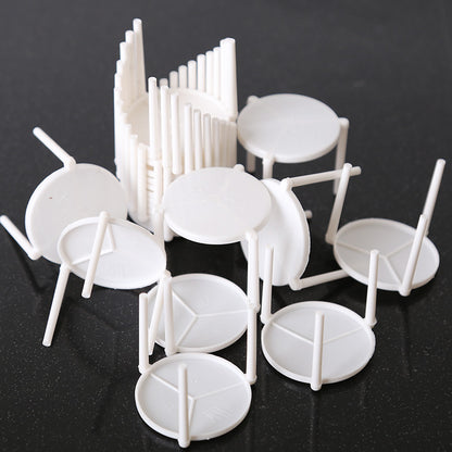 Pizza saver stand bulk cluster showing multiple scattered white units