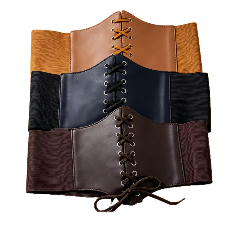 Assorted lace up elastic corset belts stacked in three colors