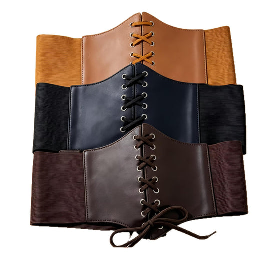 Assorted lace up elastic corset belts stacked in three colors