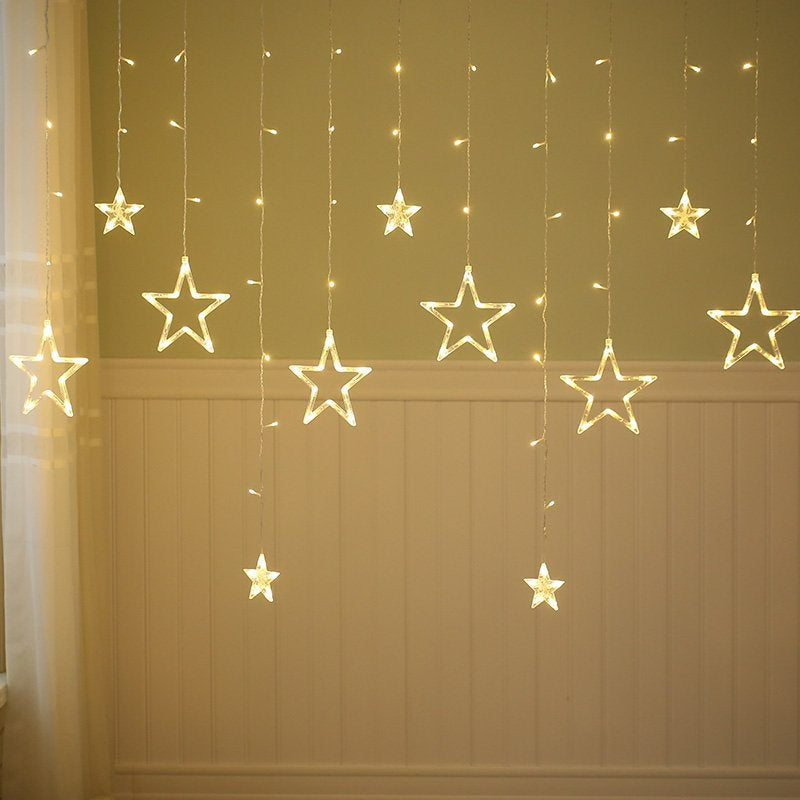 Curtain string lights warm white tiered large and small stars